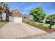 Beautiful brick home featuring a long driveway and meticulously landscaped yard at 78 Saltwind Loop, Murrells Inlet, SC 29576