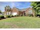 Attractive brick home boasting a lush green lawn, and well-maintained landscaping at 78 Saltwind Loop, Murrells Inlet, SC 29576