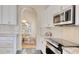 Elegant kitchen with stainless steel oven and microwave, white subway tile backsplash, and granite counters at 78 Saltwind Loop, Murrells Inlet, SC 29576