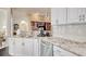 Spacious kitchen featuring stainless steel appliances and granite countertops, open to the living area at 78 Saltwind Loop, Murrells Inlet, SC 29576