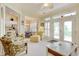 Inviting living room with comfortable armchairs, bright windows, and views to other rooms at 78 Saltwind Loop, Murrells Inlet, SC 29576