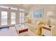 Cozy living room features a comfortable sofa, bright windows, and beach-themed decor at 78 Saltwind Loop, Murrells Inlet, SC 29576