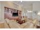 Inviting living room features a full wall built-in, comfortable seating, and a view towards the entry at 78 Saltwind Loop, Murrells Inlet, SC 29576