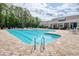 Large community pool with clear blue water, metal ladders, and several lounge chairs for sunbathing at 78 Saltwind Loop, Murrells Inlet, SC 29576