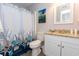 Clean bathroom features a shower with curtain, granite countertop, and stylish decor for a refreshing space at 8887 Chandler Dr. # A, Myrtle Beach, SC 29575