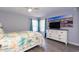 Comfortable bedroom with a ceiling fan, ample closet space and beach themed decor at 8887 Chandler Dr. # A, Myrtle Beach, SC 29575