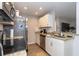 Modern kitchen features stainless steel appliances, granite countertops and lots of cabinets at 8887 Chandler Dr. # A, Myrtle Beach, SC 29575