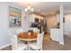 Charming kitchen with wood table, stainless steel appliances, and beach-themed decor creates a welcoming atmosphere at 8887 Chandler Dr. # A, Myrtle Beach, SC 29575