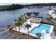 Community pool area features lounge chairs, tables, and clear views of the adjacent lake at 8887 Chandler Dr. # A, Myrtle Beach, SC 29575