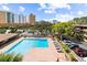 Aerial view featuring a pool, parking, trees, and condo complex at 9501 Shore Dr. # C-328, Myrtle Beach, SC 29572