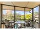Balcony featuring table and chairs, plus scenic views of greenery and the city skyline at 9501 Shore Dr. # C-328, Myrtle Beach, SC 29572
