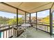Balcony with outdoor seating and a serene view of treetops and rooftops at 9501 Shore Dr. # C-328, Myrtle Beach, SC 29572