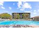 Community pool with lounge chairs and views of the condo buildings at 9501 Shore Dr. # C-328, Myrtle Beach, SC 29572