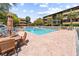 Inviting community pool area with tables, chairs, and well-maintained brick deck at 9501 Shore Dr. # C-328, Myrtle Beach, SC 29572