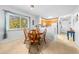 Cozy dining area featuring wooden chairs, bright natural light, and the kitchen nearby at 9501 Shore Dr. # C-328, Myrtle Beach, SC 29572