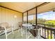 Screened porch featuring outdoor seating and a view of the neighborhood at 9501 Shore Dr. # C-328, Myrtle Beach, SC 29572