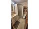 Bathroom with shower stall, patterned wallpaper, and single sink vanity at 9540 Shore Dr. # 1N, Myrtle Beach, SC 29572