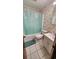 Bathroom with a shower-tub combo featuring sea themed wallpaper, tile flooring and single sink vanity at 9540 Shore Dr. # 1N, Myrtle Beach, SC 29572