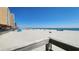 Sandy beach and ocean view from a wooden boardwalk, with blue skies above at 9540 Shore Dr. # 1N, Myrtle Beach, SC 29572