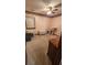 Bedroom with vintage wallpaper, carpeting, a ceiling fan, and various wicker furnishings at 9540 Shore Dr. # 1N, Myrtle Beach, SC 29572