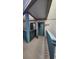 Condominium entrance featuring a teal door with a painted sign and carpeted walkway at 9540 Shore Dr. # 1N, Myrtle Beach, SC 29572