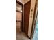 Hallway featuring wood trim, doors to bedroom and bathroom, and seaside decor at 9540 Shore Dr. # 1N, Myrtle Beach, SC 29572