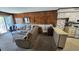 Open-concept living area featuring a comfortable seating arrangement, wood paneling, and natural light at 9540 Shore Dr. # 1N, Myrtle Beach, SC 29572