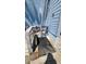 Outdoor shower on a wooden deck, attached to the blue exterior wall of the condo building at 9540 Shore Dr. # 1N, Myrtle Beach, SC 29572