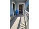 Porch with chair, view into bedroom, and ocean breeze at 9540 Shore Dr. # 1N, Myrtle Beach, SC 29572