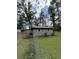 Spacious backyard with chain link fencing and small storage shed at 972 Mount Carmel Rd., Hemingway, SC 29554