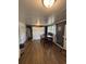 Functional dining area with wood floors, a spacious table, and a large closet at 972 Mount Carmel Rd., Hemingway, SC 29554