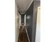 Hallway with wood-look floors, neutral paint, and multiple doorways leading to other rooms at 972 Mount Carmel Rd., Hemingway, SC 29554
