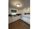 Bright kitchen with white cabinets, modern appliances, and wood-look floors at 972 Mount Carmel Rd., Hemingway, SC 29554