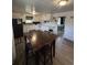 Well-lit kitchen boasts white cabinetry, eat-in table, and seamlessly connects to the living area at 972 Mount Carmel Rd., Hemingway, SC 29554