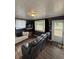 Inviting living room featuring sleek floors, modern decor, and access to the outdoors at 972 Mount Carmel Rd., Hemingway, SC 29554