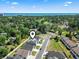 Stunning aerial view of a residential area near the ocean, boasting picturesque homes and lush landscapes at 1010 Graybill Lane, North Myrtle Beach, SC 29582