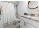 Bathroom featuring a vanity with granite countertop and a shower with white curtain at 1010 Graybill Lane, North Myrtle Beach, SC 29582