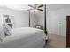 Cozy bedroom with a four-poster bed, soft lighting, and ample closet space at 1010 Graybill Lane, North Myrtle Beach, SC 29582