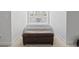 Cozy bedroom featuring a bed with decorative pillows, and a leather storage ottoman at 1010 Graybill Lane, North Myrtle Beach, SC 29582