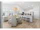 Bright dining area open to the kitchen with white cabinetry and stainless steel appliances at 1010 Graybill Lane, North Myrtle Beach, SC 29582