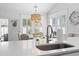 Kitchen with a breakfast bar and dining area under a decorative lighting fixture at 1010 Graybill Lane, North Myrtle Beach, SC 29582