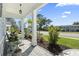 Charming front porch with well-manicured landscaping, decorative plants, and a welcoming entrance, enhancing the home's curb appeal at 1010 Graybill Lane, North Myrtle Beach, SC 29582