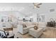 Bright, open-concept living space with a large sectional sofa and views of the kitchen and dining area at 1010 Graybill Lane, North Myrtle Beach, SC 29582