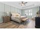 Serene main bedroom with a tray ceiling, a ceiling fan, and soothing color palette at 1010 Graybill Lane, North Myrtle Beach, SC 29582