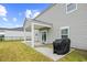 The backyard offers a covered patio and sliding glass doors for easy outdoor enjoyment at 1015 Saltgrass Way, Myrtle Beach, SC 29588