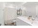 Bright bathroom featuring a sink, toilet, shower with curtain and rustic shelving at 1015 Saltgrass Way, Myrtle Beach, SC 29588