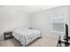 Cozy bedroom with neutral walls and carpet, side tables and a patterned bedspread at 1015 Saltgrass Way, Myrtle Beach, SC 29588