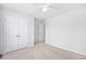 Light-filled bedroom with neutral walls, plush carpet, and a double door closet at 1015 Saltgrass Way, Myrtle Beach, SC 29588