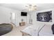 Spacious bedroom with ceiling fan and ensuite bathroom at 1015 Saltgrass Way, Myrtle Beach, SC 29588