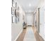 Inviting entryway featuring hardwood floors, gallery wall and a rustic barn door at 1015 Saltgrass Way, Myrtle Beach, SC 29588